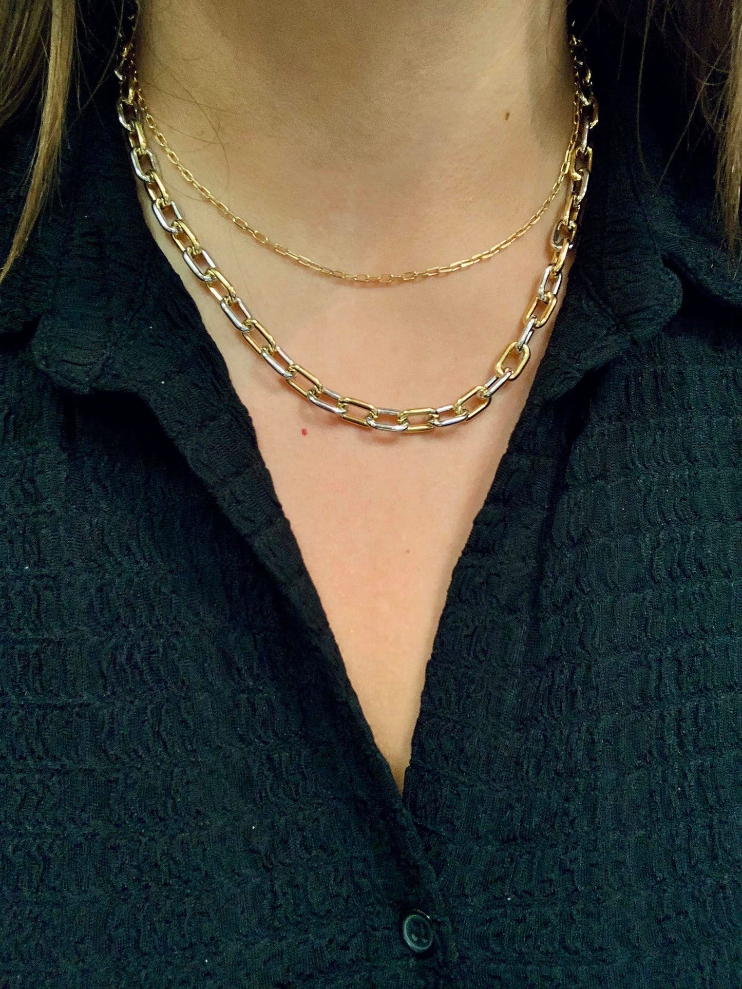 Photo of Chain Link Necklace in a decorative scene, designed by -, available at Plumb Gold & Plumb Silver