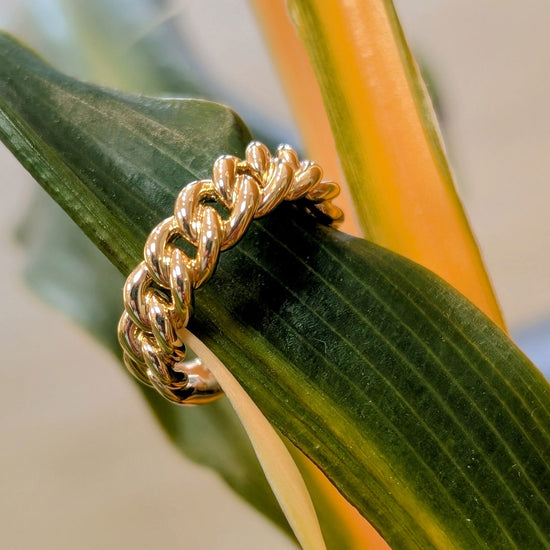 Photo of Chain Link Ring in a decorative scene, designed by , available at Plumb Gold & Plumb Silver