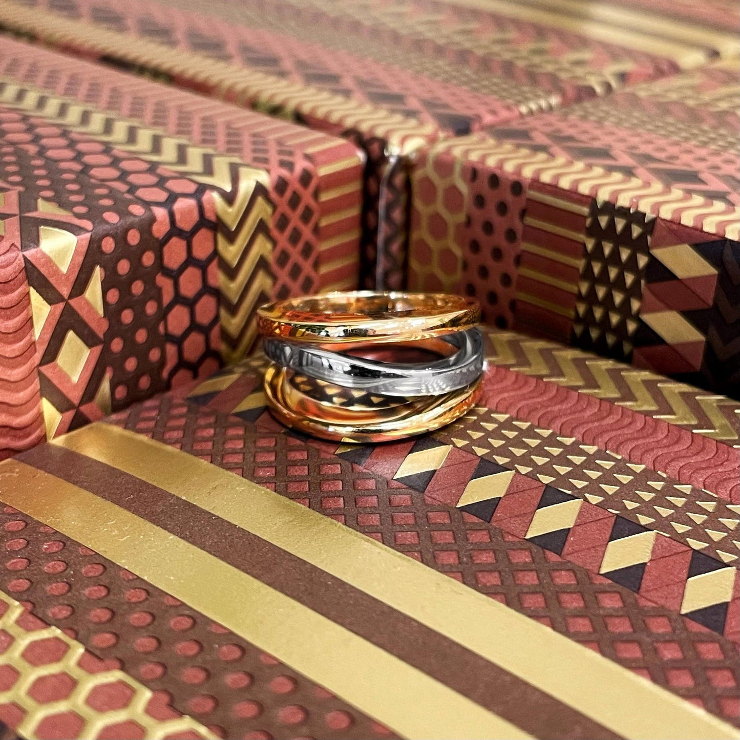 Photo of Channel Ring in a decorative scene, designed by , available at Plumb Gold & Plumb Silver