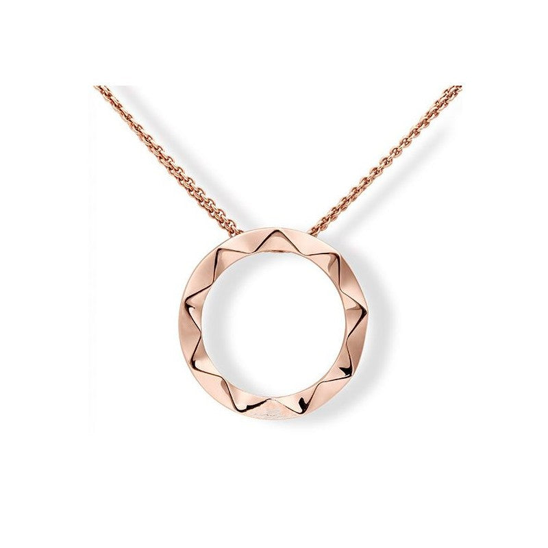 Photo of Chevron Circle Pendant in a decorative scene, designed by , available at Plumb Gold & Plumb Silver