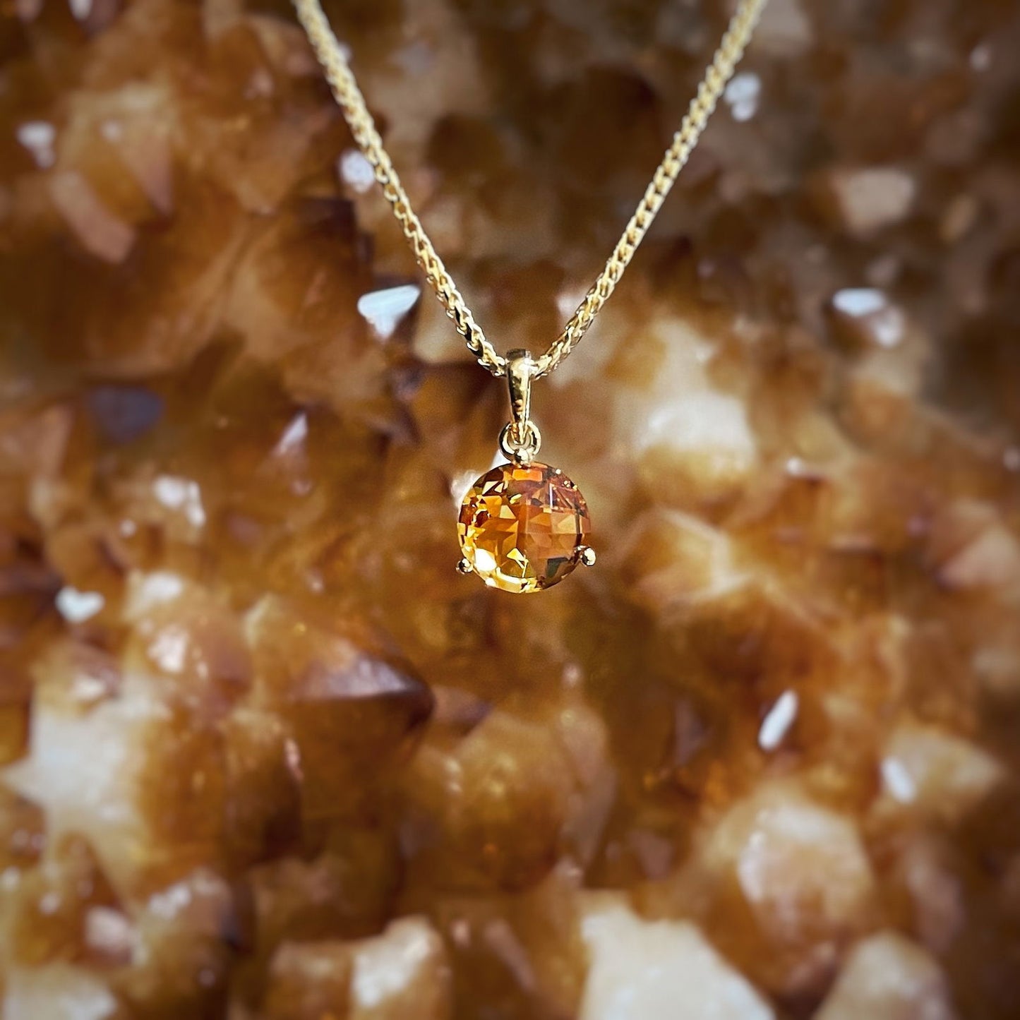 Photo of Citrine Pendant in a decorative scene, designed by , available at Plumb Gold & Plumb Silver