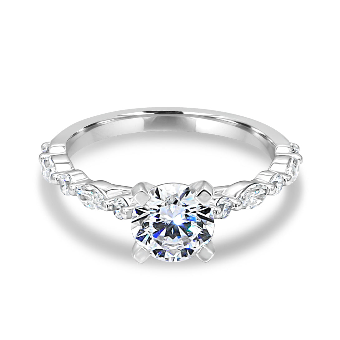 Photo of "Clarice" Solitaire Mounting in a decorative scene, designed by , available at Plumb Gold & Plumb Silver