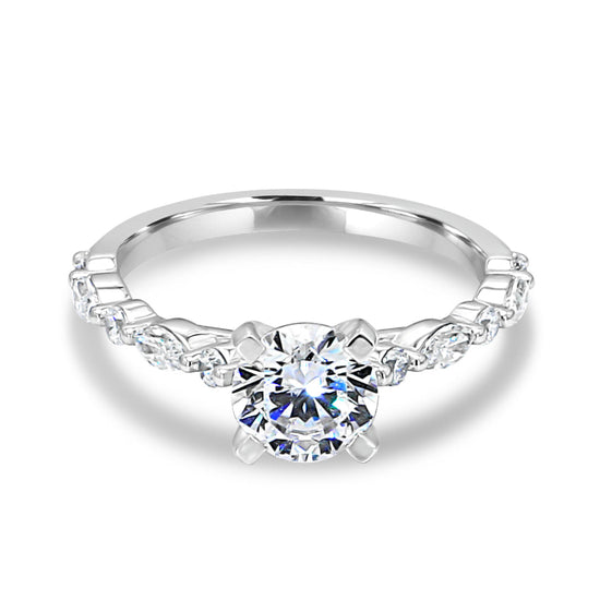 Photo of "Clarice" Solitaire Mounting in a decorative scene, designed by , available at Plumb Gold & Plumb Silver