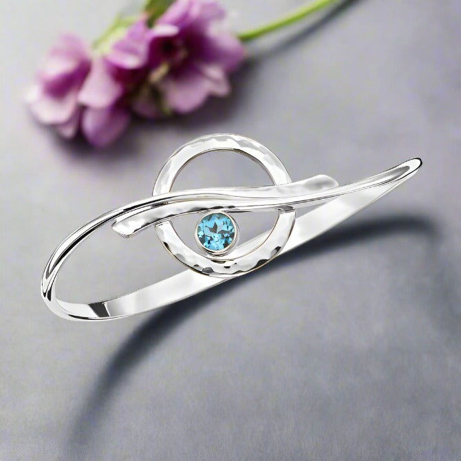 Photo of "Cloudburst" Bracelet in a decorative scene, designed by , available at Plumb Gold & Plumb Silver