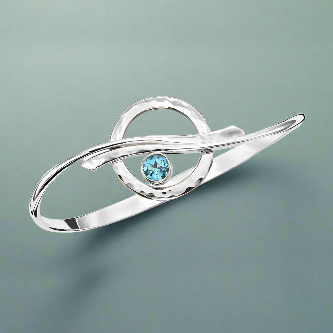Photo of "Cloudburst" Bracelet in a decorative scene, designed by , available at Plumb Gold & Plumb Silver