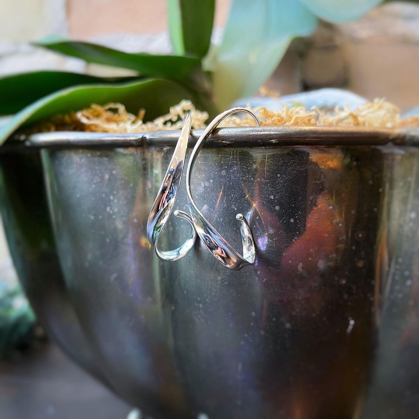 Photo of "Coastal" Earrings in a decorative scene, designed by , available at Plumb Gold & Plumb Silver