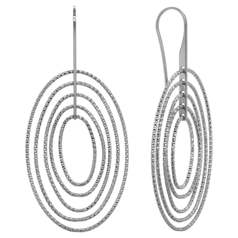 Photo of Concentric Oval Earrings in a decorative scene, designed by , available at Plumb Gold & Plumb Silver