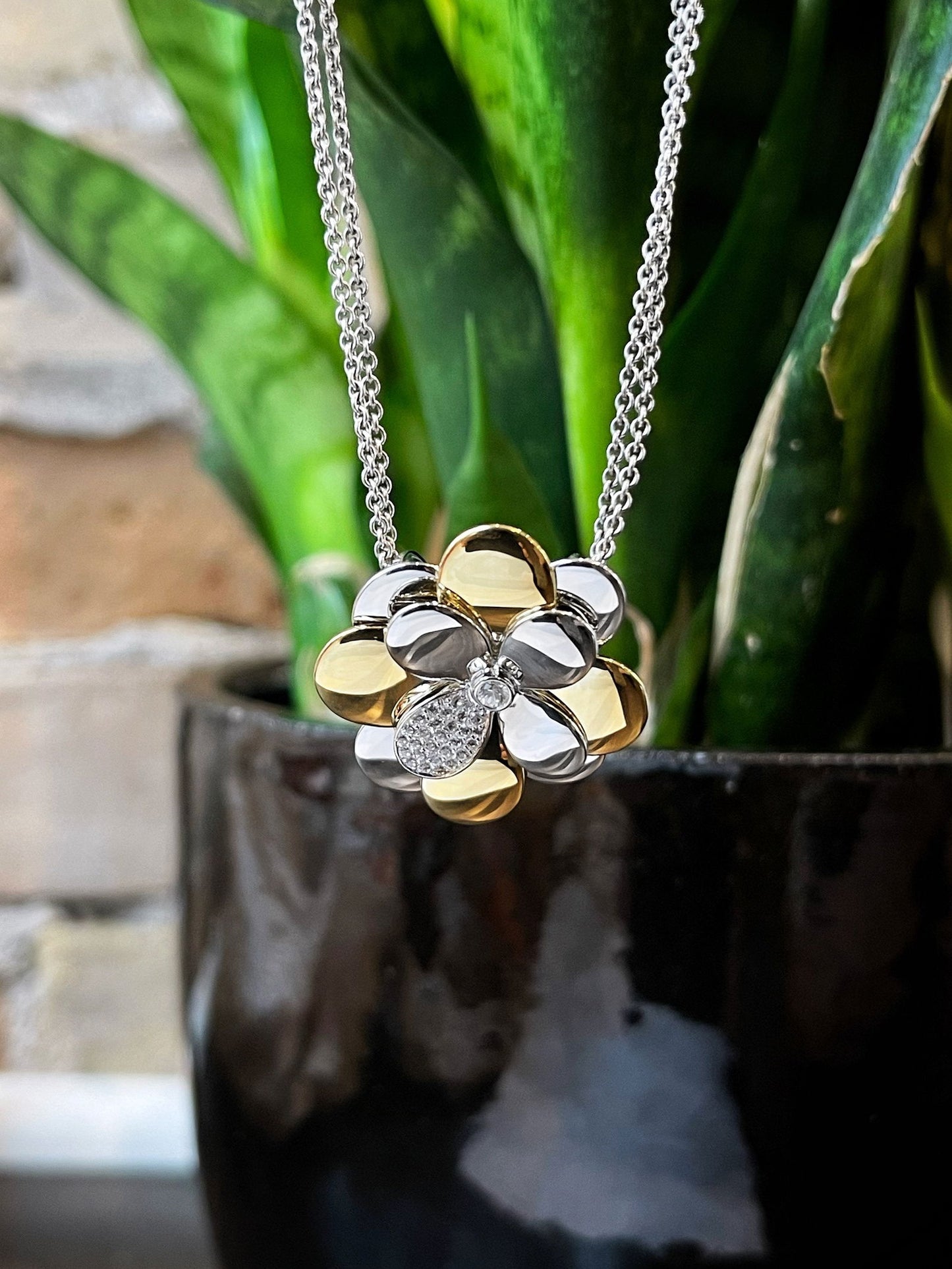 Photo of Daisy Pendant in a decorative scene, designed by , available at Plumb Gold & Plumb Silver