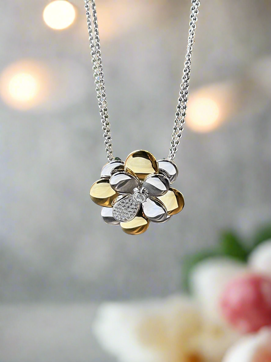 Photo of Daisy Pendant in a decorative scene, designed by , available at Plumb Gold & Plumb Silver