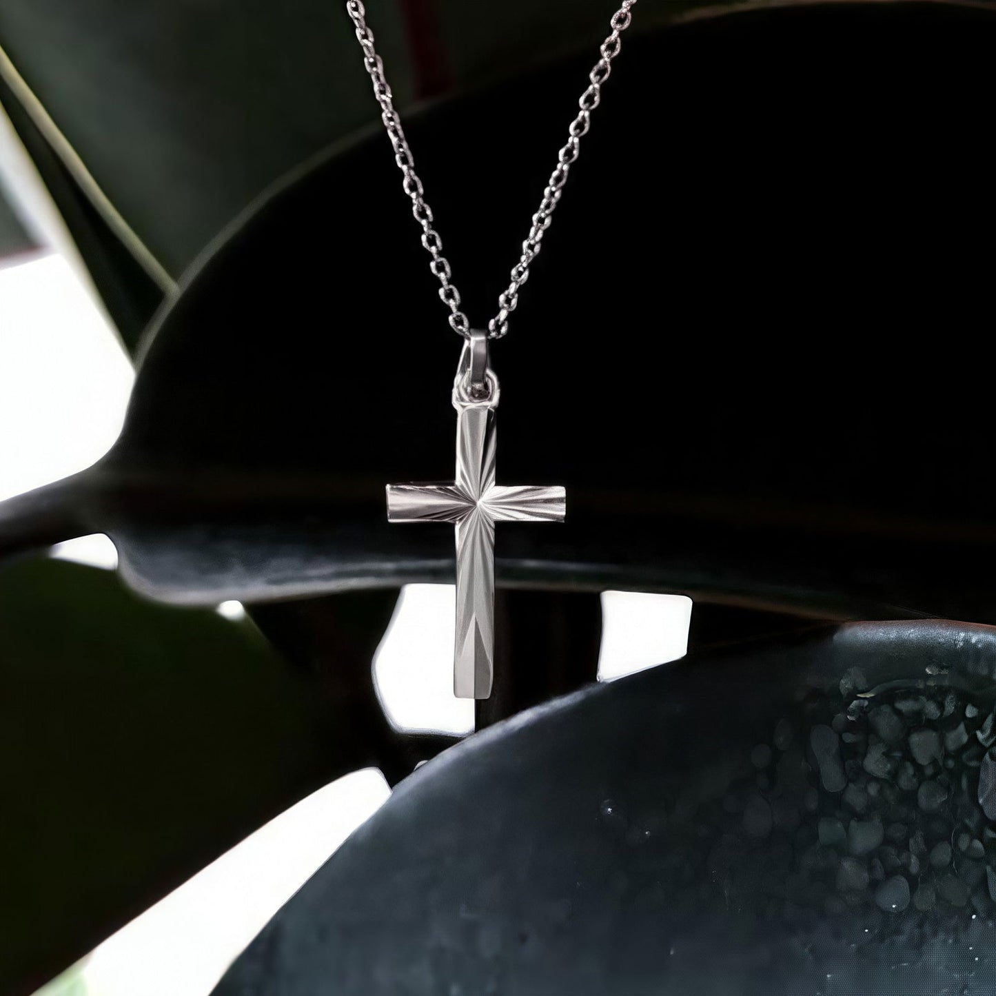 Photo of Diamond-Cut Cross in a decorative scene, designed by -, available at Plumb Gold & Plumb Silver