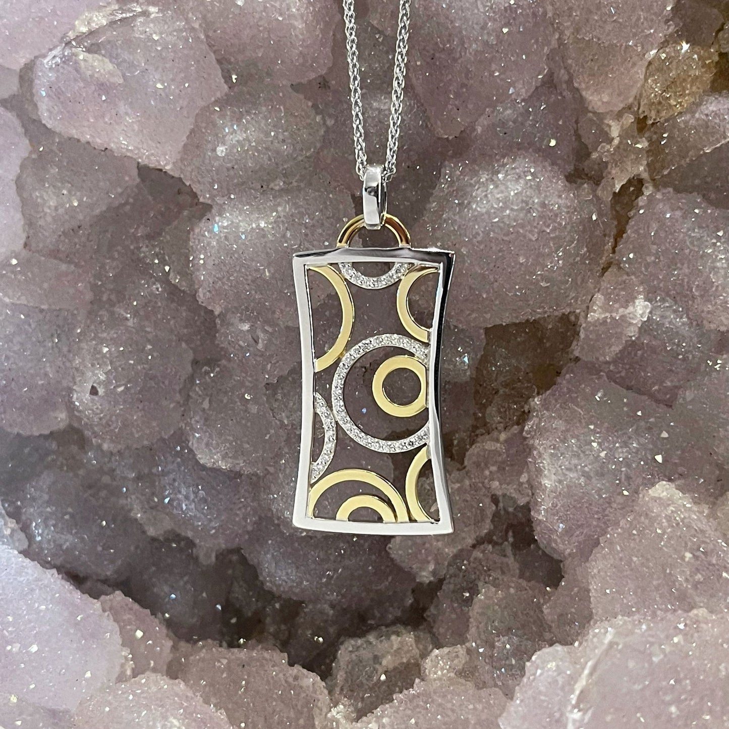 Photo of Diamond Bubbles Pendant in a decorative scene, designed by , available at Plumb Gold & Plumb Silver