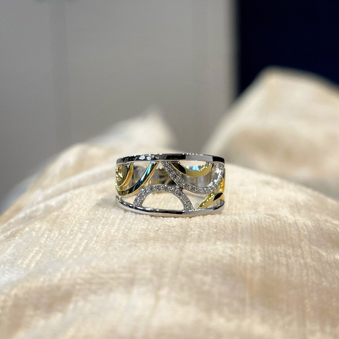 Photo of Diamond Bubbles Ring in a decorative scene, designed by , available at Plumb Gold & Plumb Silver