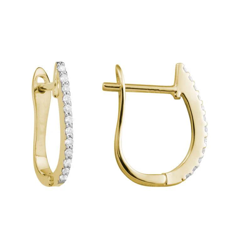 Photo of Diamond Huggie Earring in a decorative scene, designed by , available at Plumb Gold & Plumb Silver