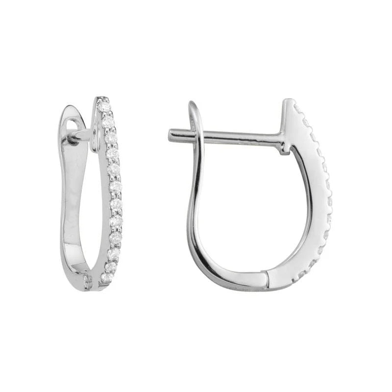 Photo of Diamond Huggie Earring in a decorative scene, designed by , available at Plumb Gold & Plumb Silver