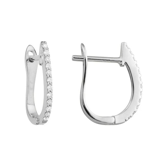 Photo of Diamond Huggie Earring in a decorative scene, designed by , available at Plumb Gold & Plumb Silver