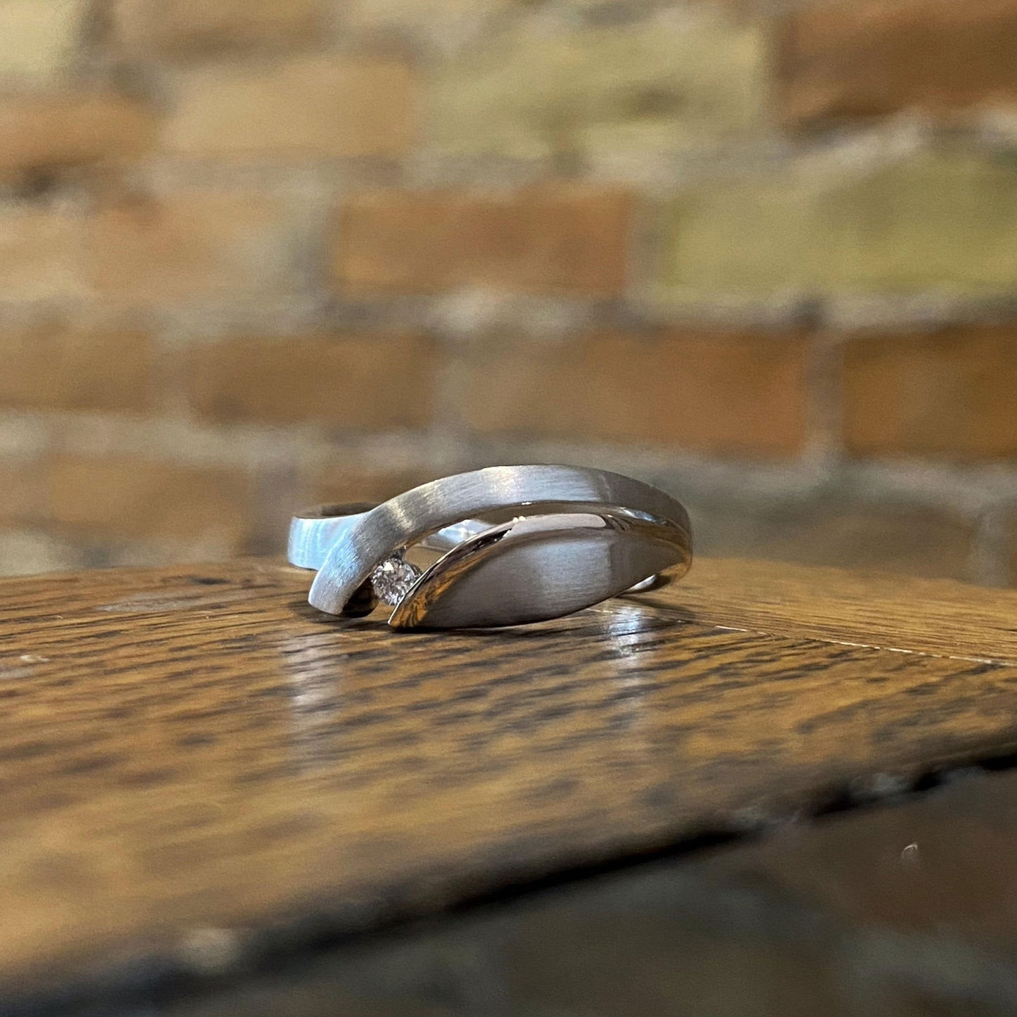 Photo of Diamond Leaf Ring in a decorative scene, designed by , available at Plumb Gold & Plumb Silver