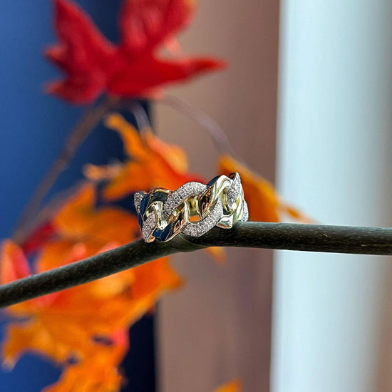 Photo of Diamond Link Ring in a decorative scene, designed by , available at Plumb Gold & Plumb Silver