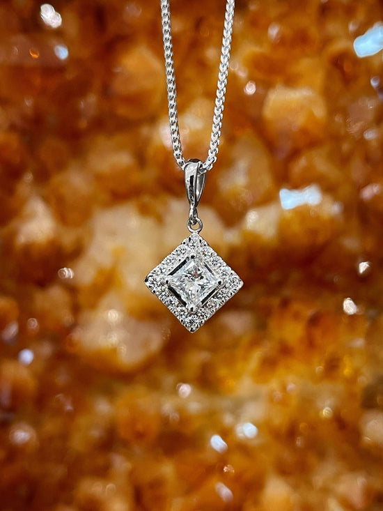 Photo of Diamond Pendant in a decorative scene, designed by , available at Plumb Gold & Plumb Silver