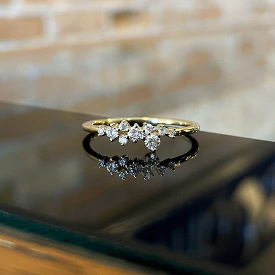 Photo of Diamond Scatter Ring in a decorative scene, designed by , available at Plumb Gold & Plumb Silver