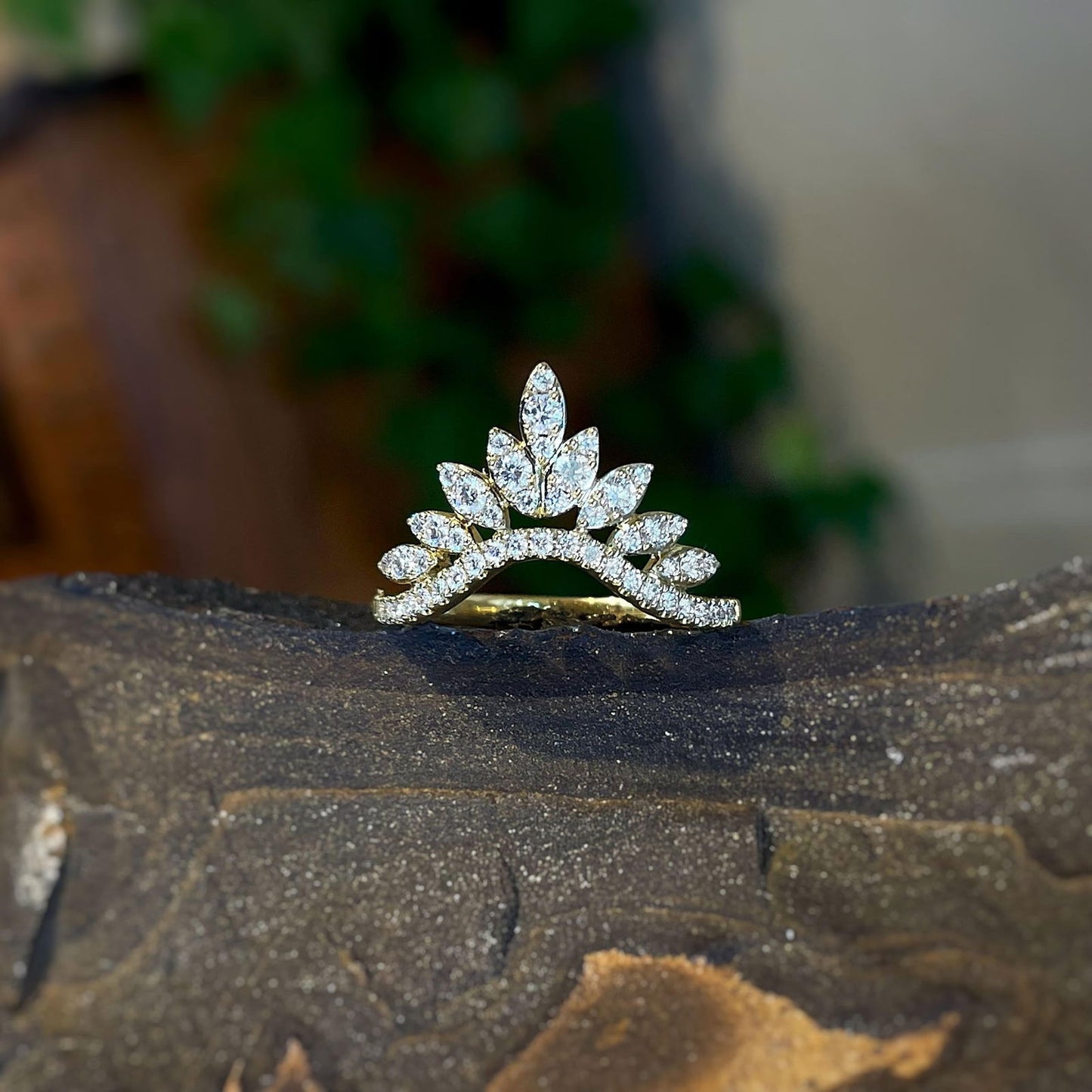 Photo of Diamond Tiara Contour Band in a decorative scene, designed by , available at Plumb Gold & Plumb Silver