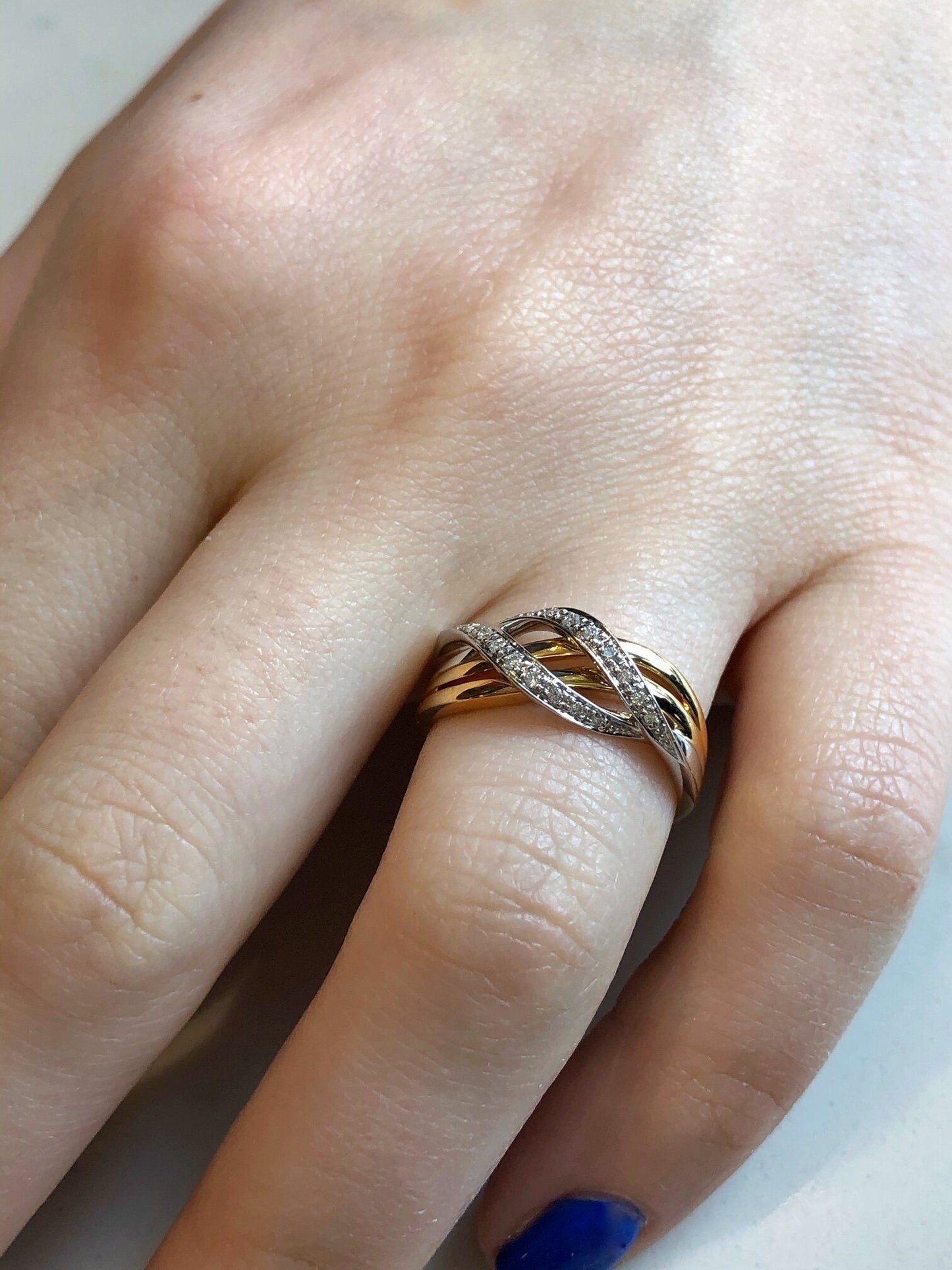 Photo of Diamond Wave Ring in a decorative scene, designed by , available at Plumb Gold & Plumb Silver