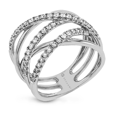 Photo of Diamond crossover Ring in a decorative scene, designed by , available at Plumb Gold & Plumb Silver