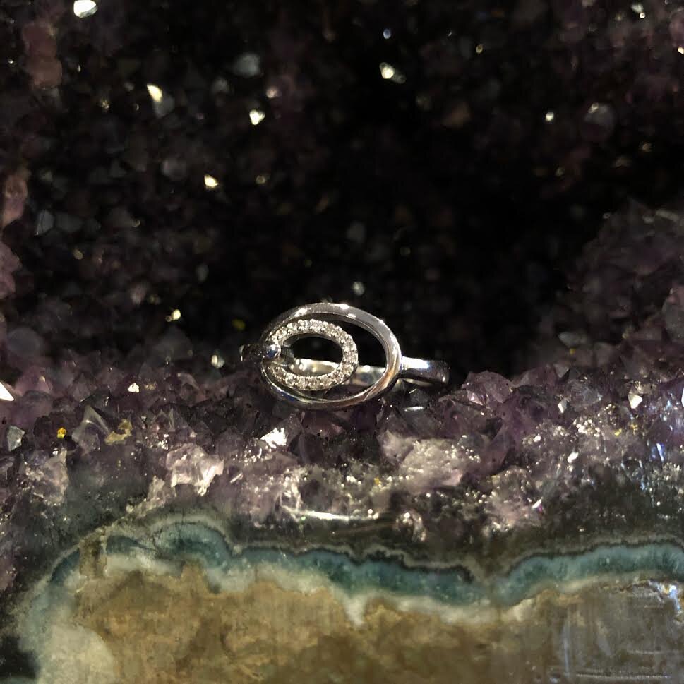 Photo of Double Oval Diamond Ring in a decorative scene, designed by , available at Plumb Gold & Plumb Silver