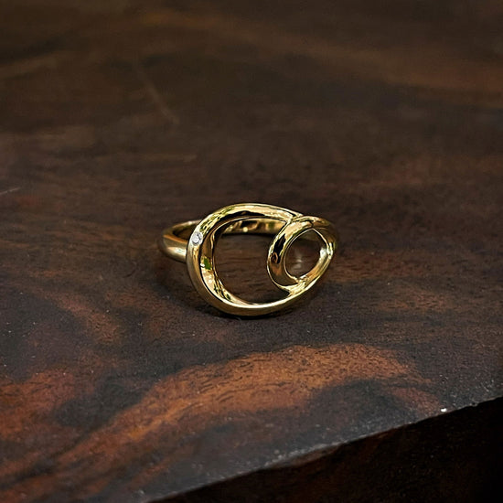 Photo of Double Oval Diamond Ring in a decorative scene, designed by , available at Plumb Gold & Plumb Silver