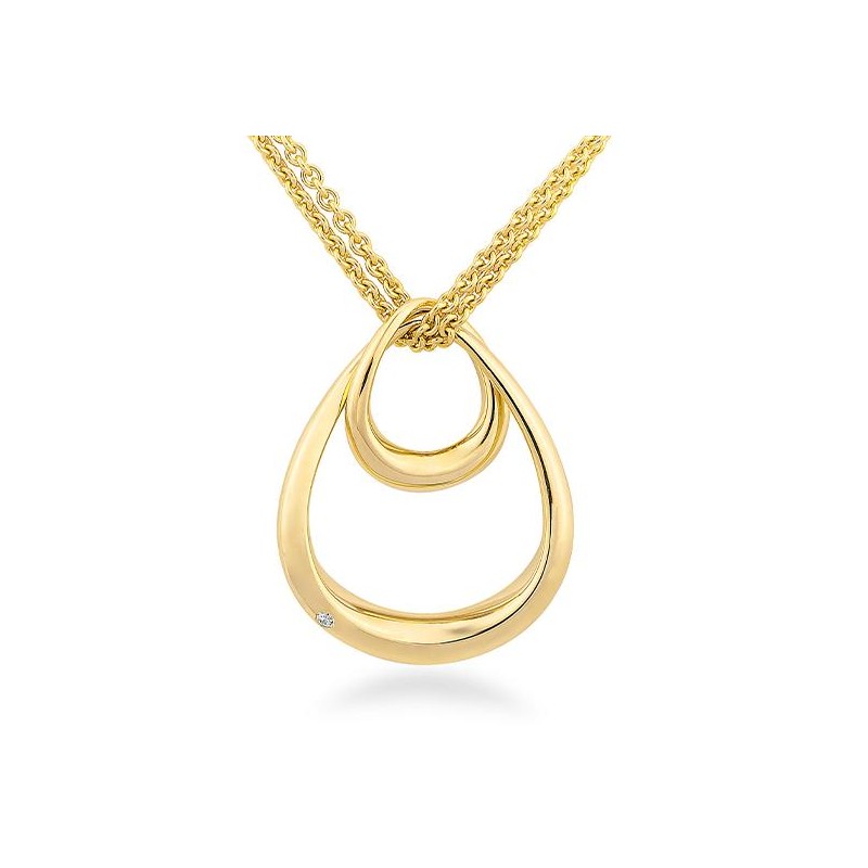Photo of Double Oval Pendant in a decorative scene, designed by , available at Plumb Gold & Plumb Silver