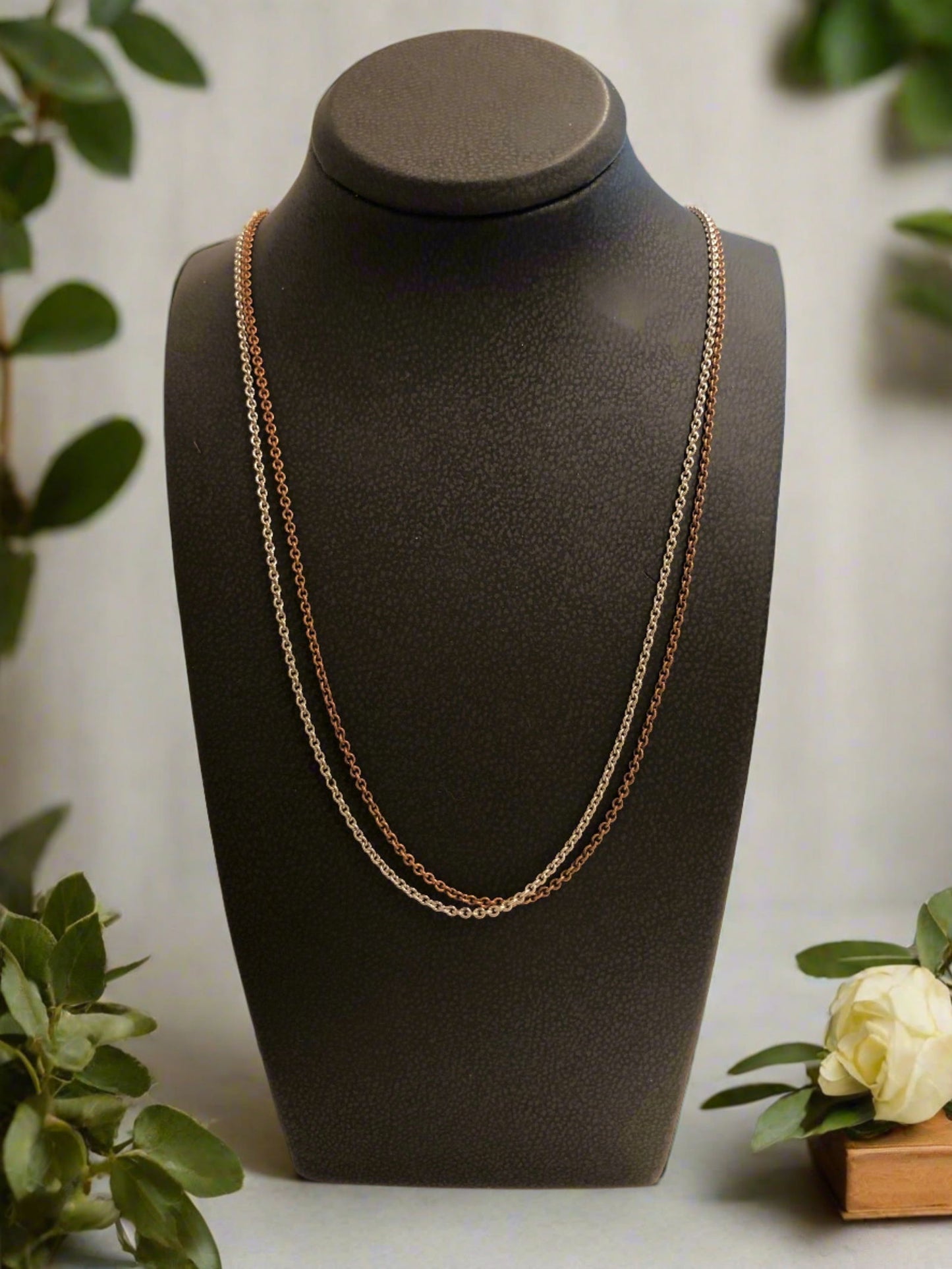 Photo of Double Strand Chain in a decorative scene, designed by , available at Plumb Gold & Plumb Silver