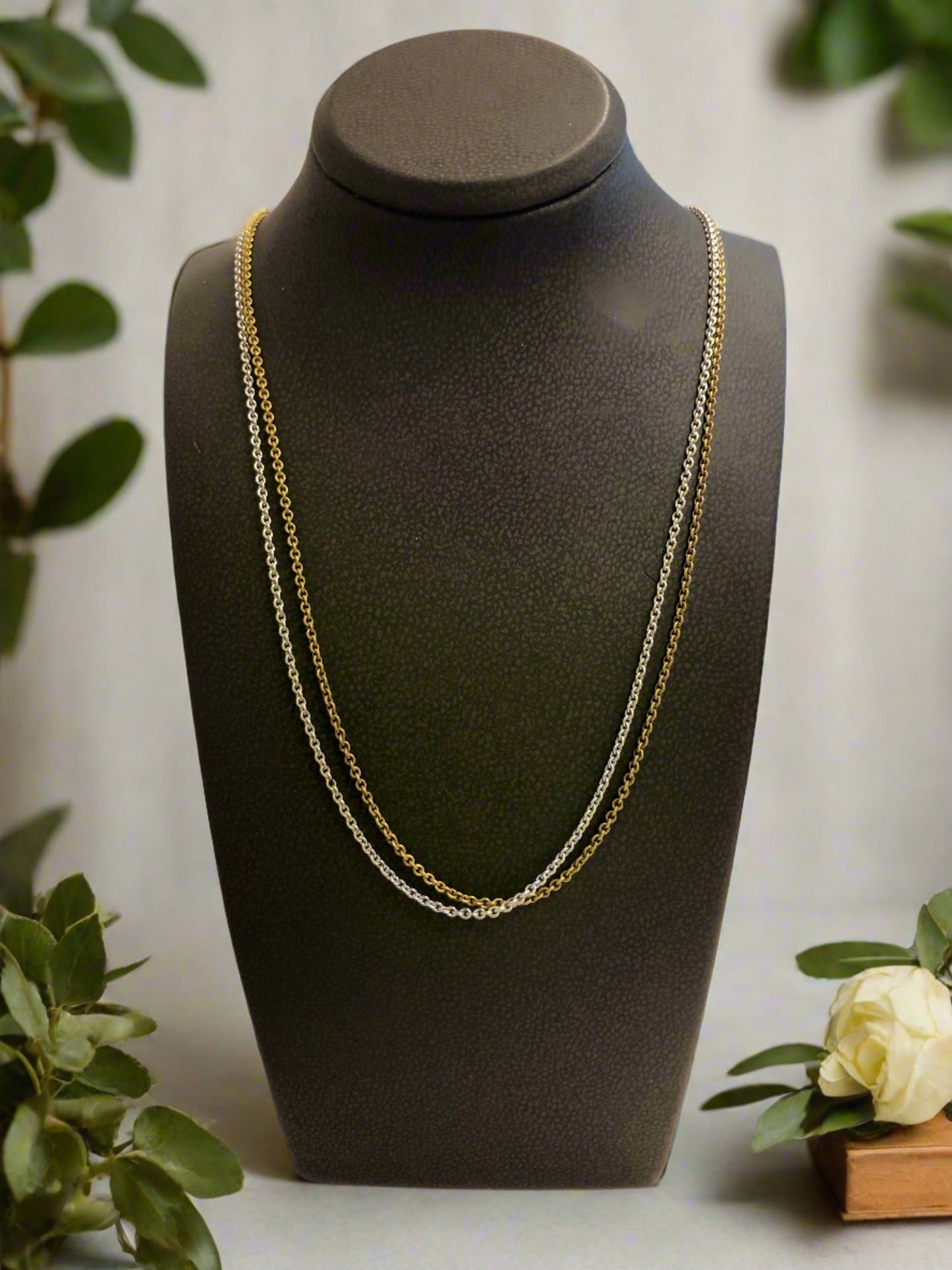 Photo of Double Strand Chain in a decorative scene, designed by , available at Plumb Gold & Plumb Silver