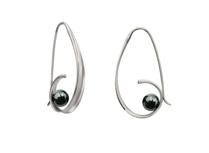 Photo of EL Designs "Crosswind" Hematite Earrings in a decorative scene, designed by , available at Plumb Gold & Plumb Silver