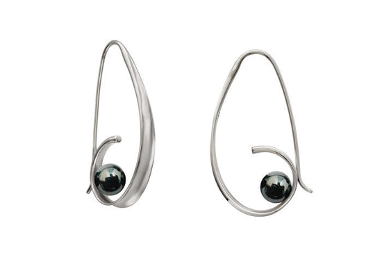 Photo of EL Designs "Crosswind" Hematite Earrings in a decorative scene, designed by , available at Plumb Gold & Plumb Silver