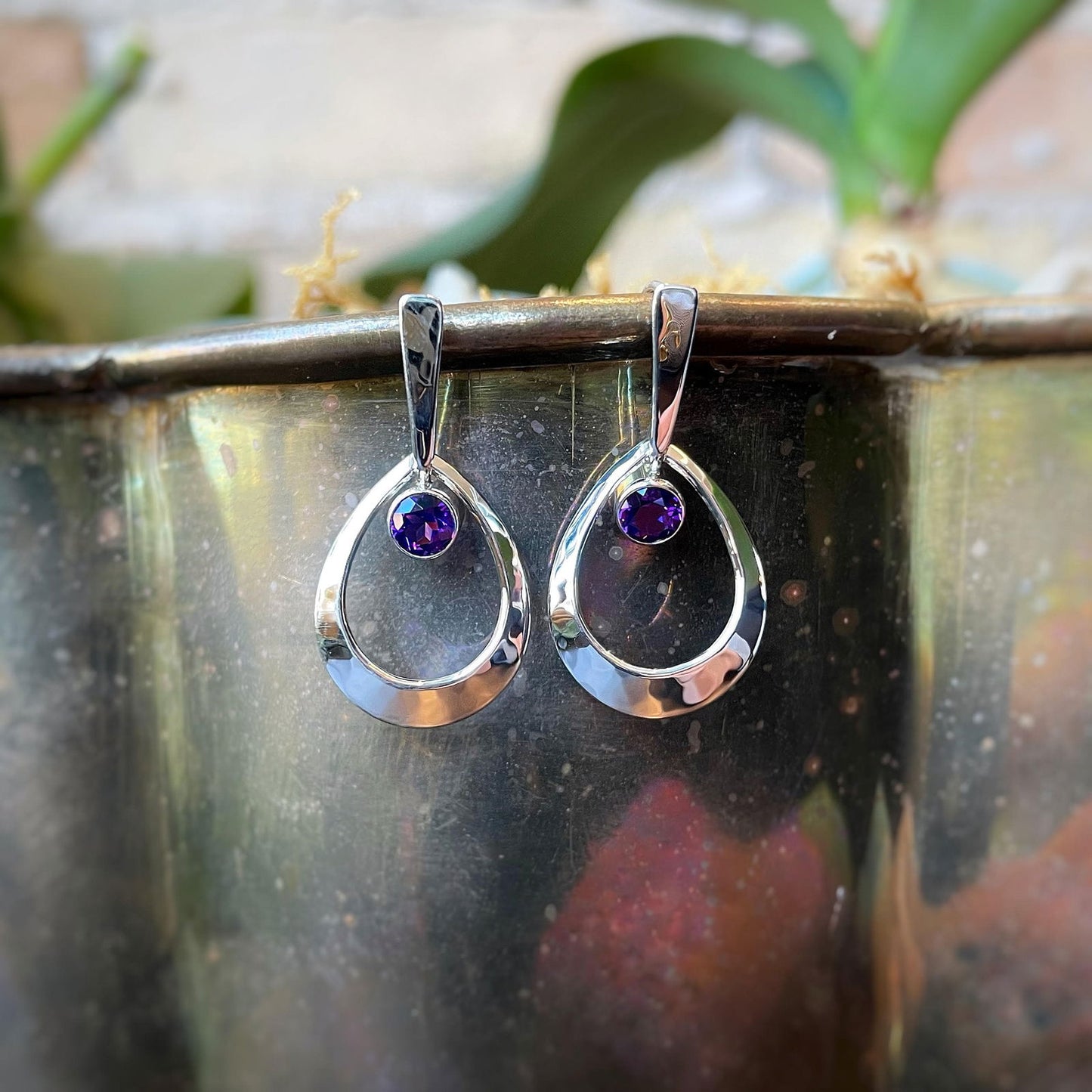 Photo of EL Designs "Emma" Amethyst Earrings in a decorative scene, designed by , available at Plumb Gold & Plumb Silver