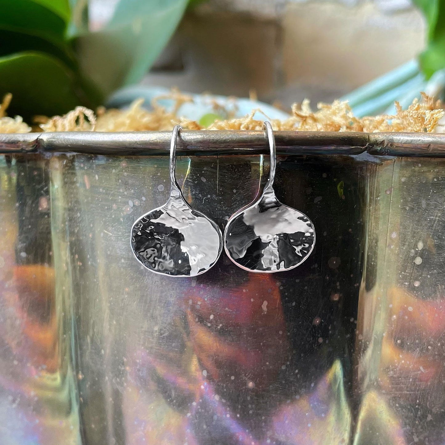Photo of E L Designs "Dusk" Sterling SilverDrop Earrings in a decorative scene, designed by , available at Plumb Gold & Plumb Silver