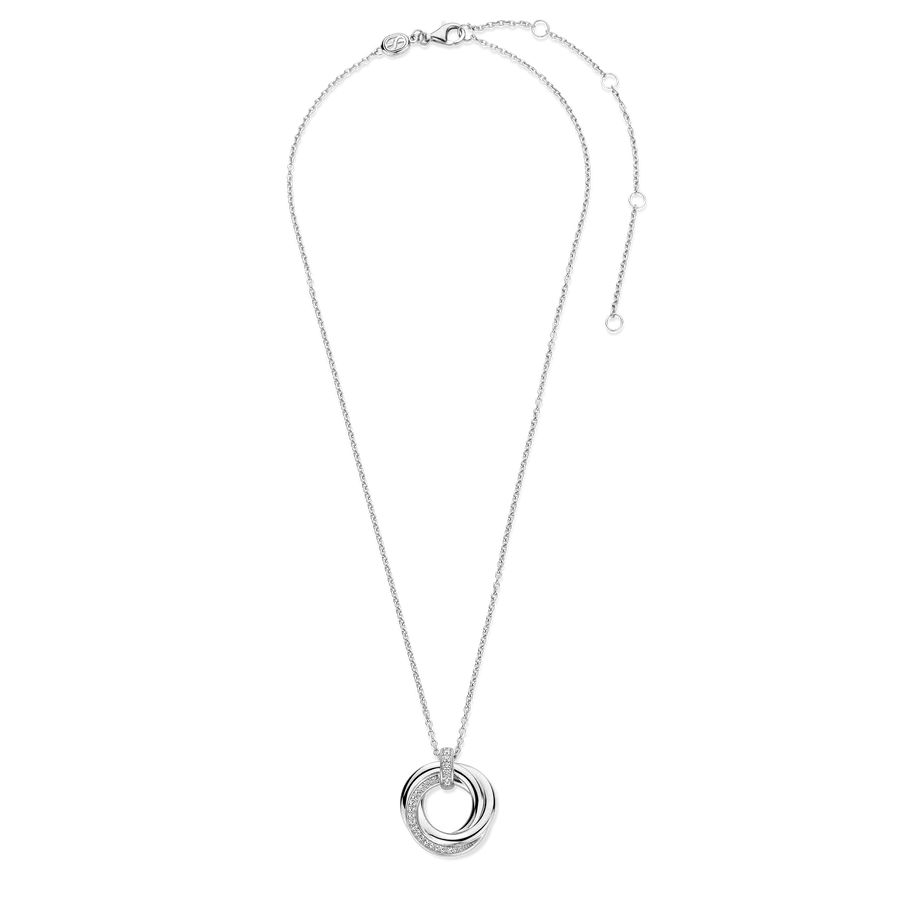 Photo of Entwined Circles Necklace in a decorative scene, designed by -, available at Plumb Gold & Plumb Silver