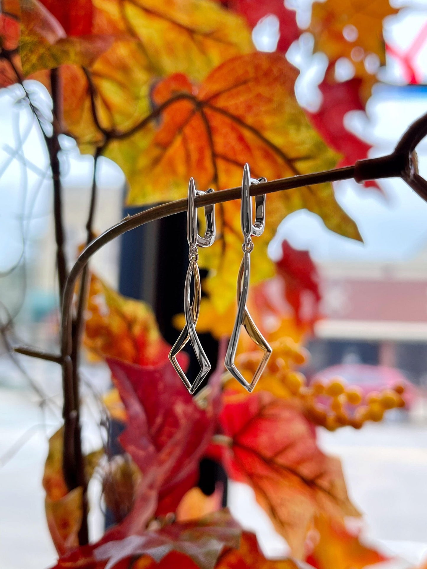Photo of Entwined Dangles in a decorative scene, designed by , available at Plumb Gold & Plumb Silver