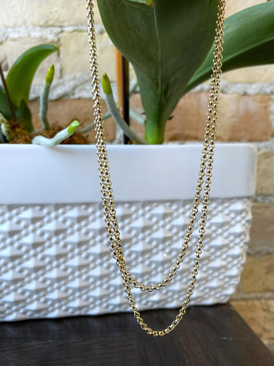 Photo of Fancy Curb Link Chain in a decorative scene, designed by , available at Plumb Gold & Plumb Silver