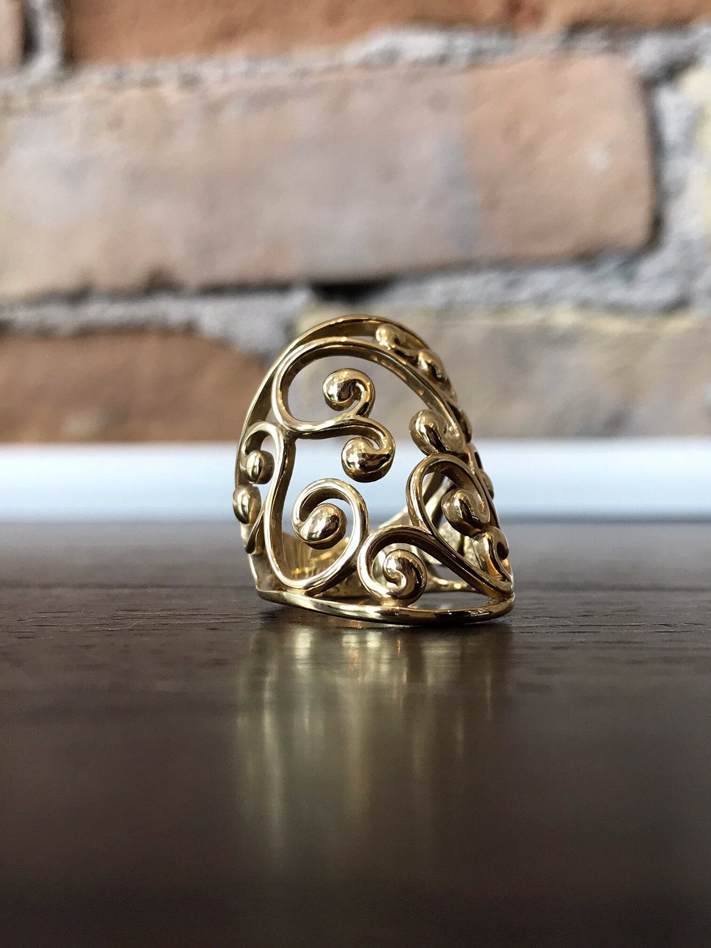 Photo of Filigree Ring in a decorative scene, designed by , available at Plumb Gold & Plumb Silver