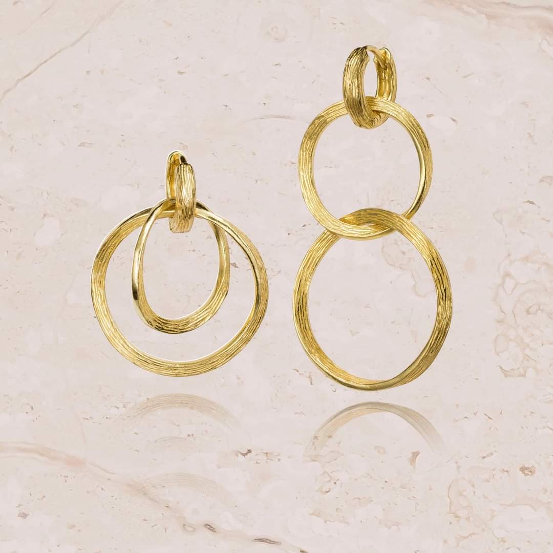 Photo of "Florence" Dangle Earring in a decorative scene, designed by , available at Plumb Gold & Plumb Silver