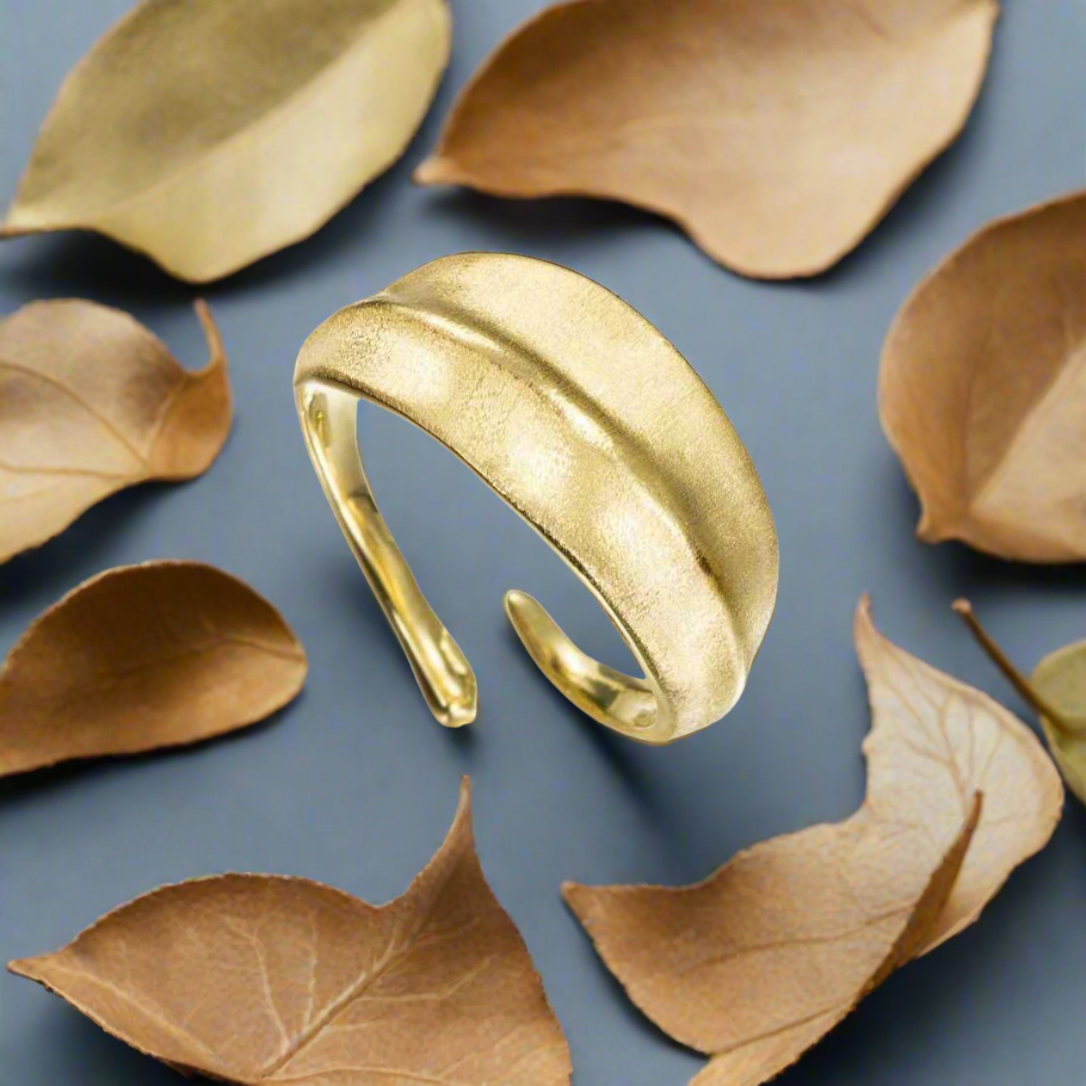 Photo of "Forest" Ring in a decorative scene, designed by , available at Plumb Gold & Plumb Silver