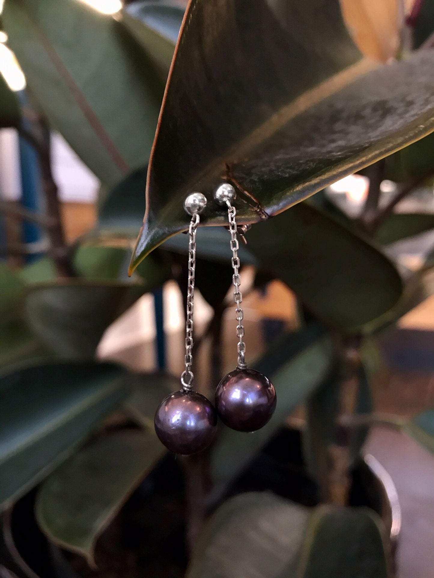 Photo of Freshwater Pearl Dangles in a decorative scene, designed by , available at Plumb Gold & Plumb Silver