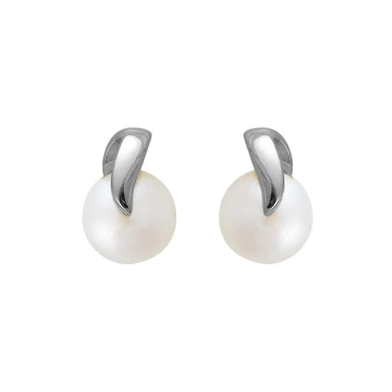 Photo of Freshwater Pearl Swirl Stud in a decorative scene, designed by , available at Plumb Gold & Plumb Silver