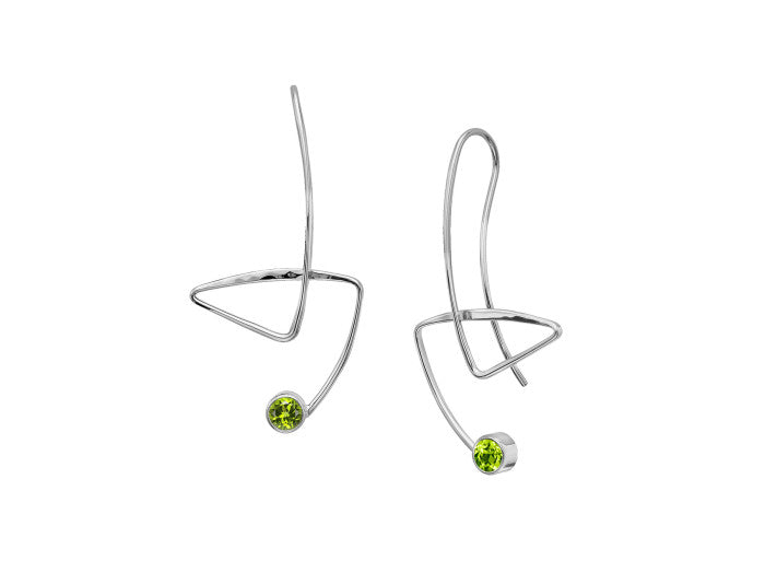 Photo of "Gadabout" Earrings in a decorative scene, designed by , available at Plumb Gold & Plumb Silver