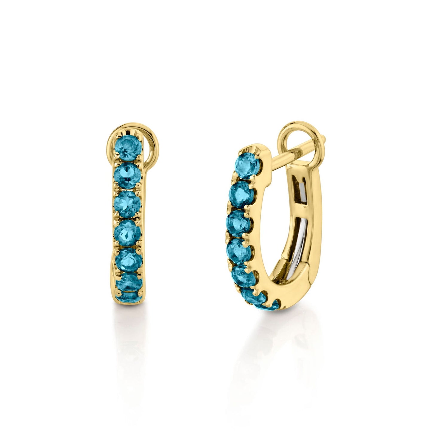 Photo of Gemstone Huggies in a decorative scene, designed by -, available at Plumb Gold & Plumb Silver