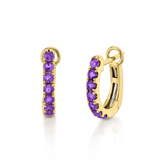 Photo of Gemstone Huggies in a decorative scene, designed by -, available at Plumb Gold & Plumb Silver