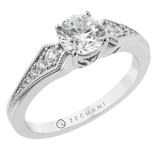 Photo of "Grace" Deco Milgrain Engagement Ring in a decorative scene, designed by , available at Plumb Gold & Plumb Silver