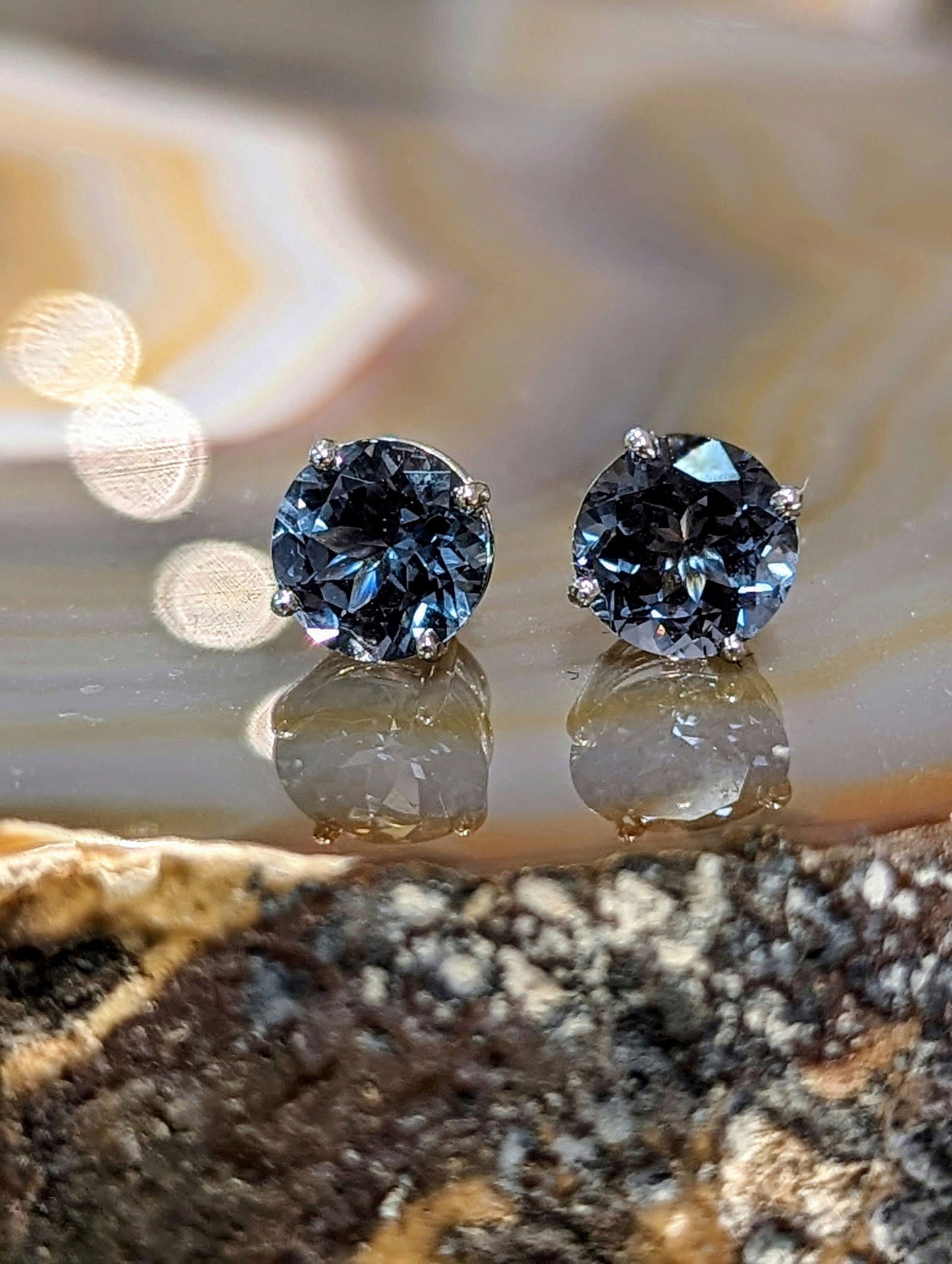 Photo of Grey Spinel Studs in a decorative scene, designed by , available at Plumb Gold & Plumb Silver
