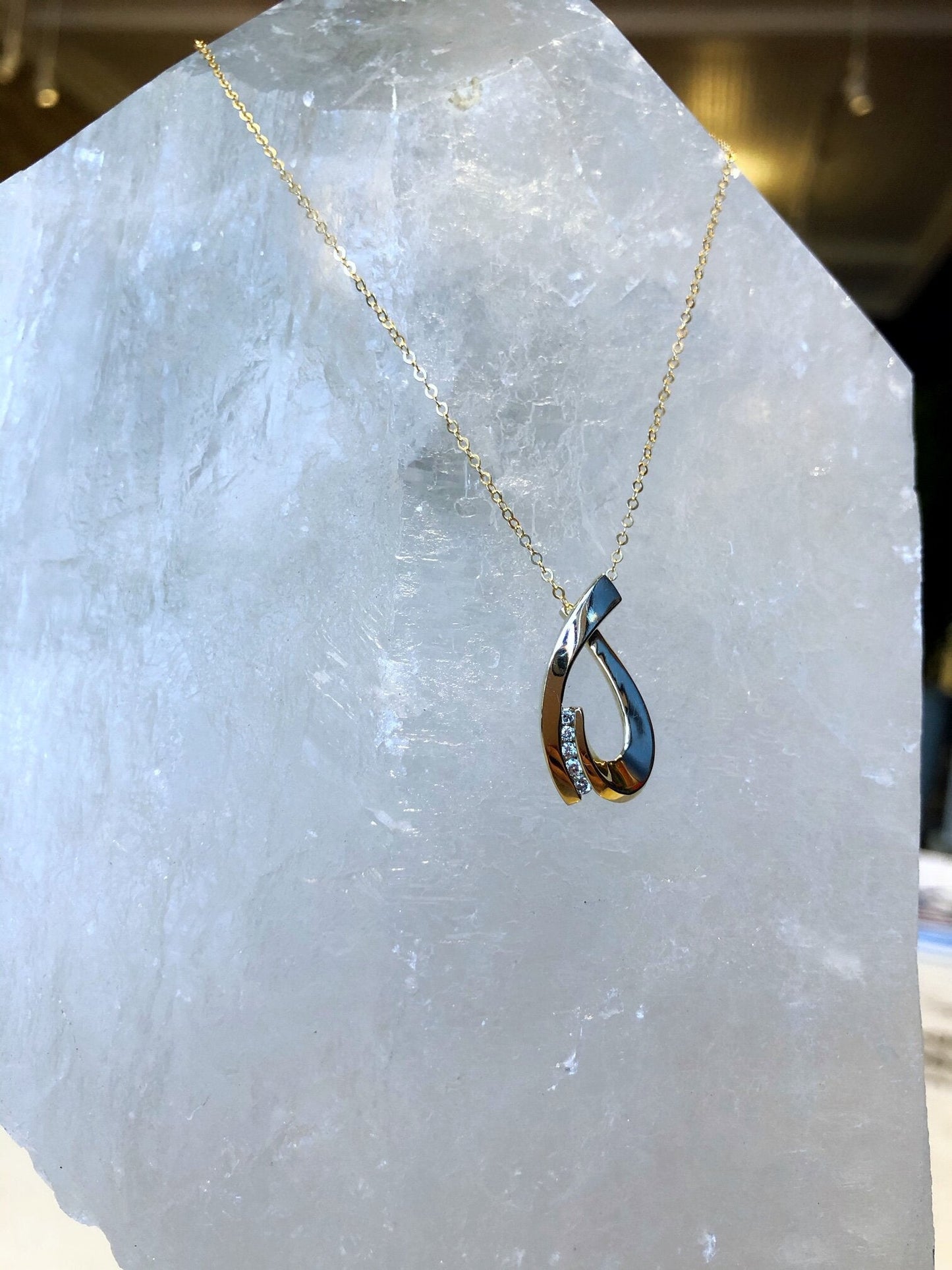Photo of HL Designs Loop Slide in a decorative scene, designed by , available at Plumb Gold & Plumb Silver