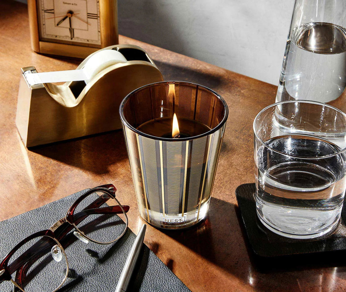 Photo of Hearth Candle in a decorative scene, designed by , available at Plumb Gold & Plumb Silver